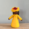 A felt Firewheel Flower Fairy wearing  golden yellow dress and firewheel flower on her head with dark skin tone | © Conscious Craft